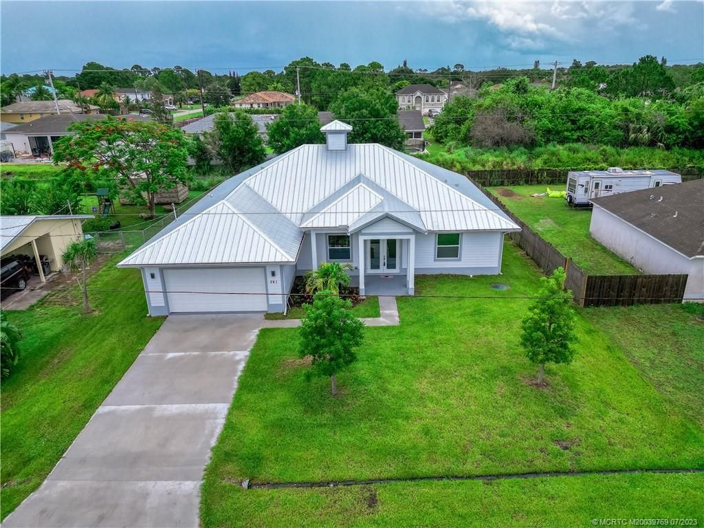 Photo of 261 NW Biltmore Street, Port Saint Lucie, FL 34983 (MLS # M20039769)