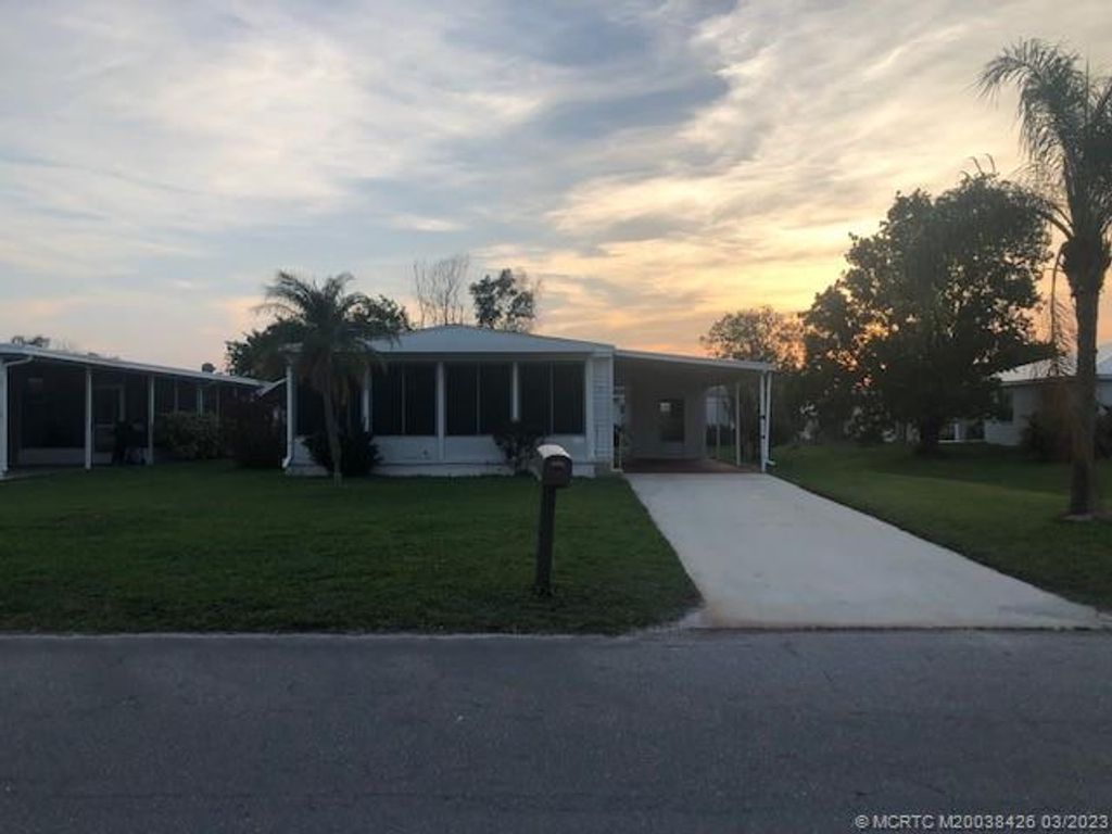 Photo of 21 Los Lagos Ln, Port Saint Lucie, FL 34952 (MLS # M20038426)
