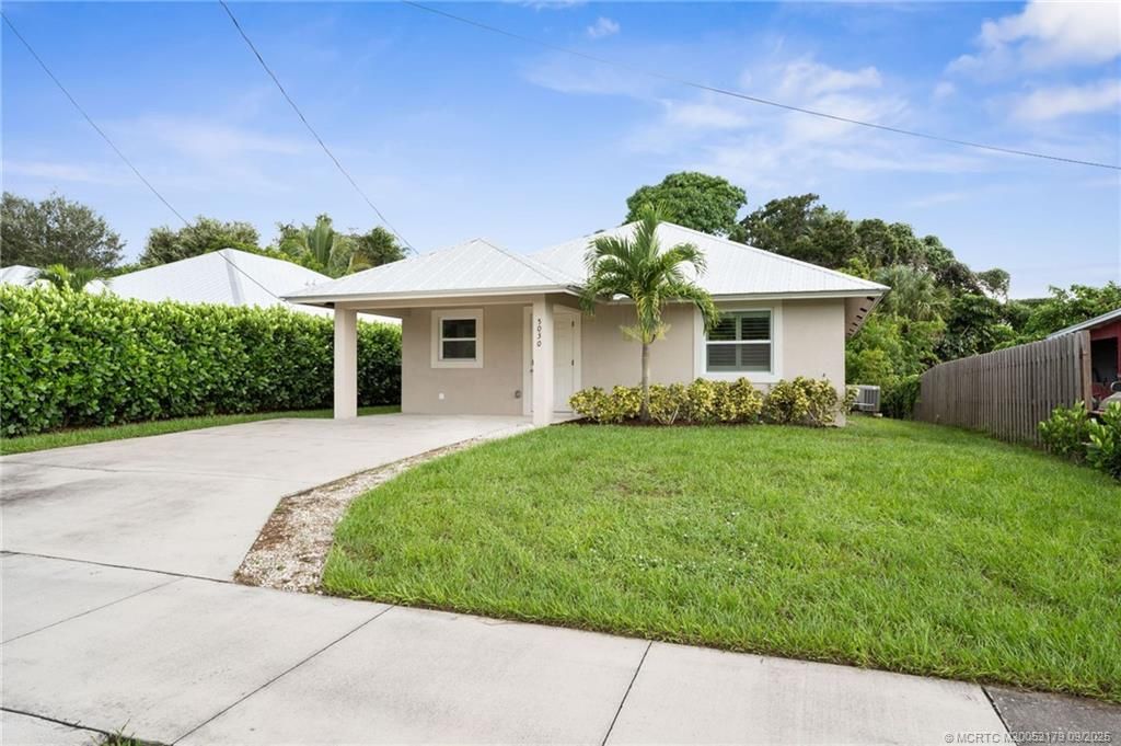 Photo of 5030 SE Ebbtide Avenue, Stuart, FL 34997 (MLS # M20052179)