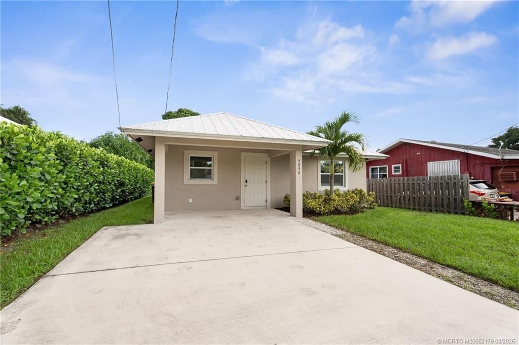 Photo of 5030 SE Ebbtide Avenue, Stuart, FL 34997 (MLS # M20052179)