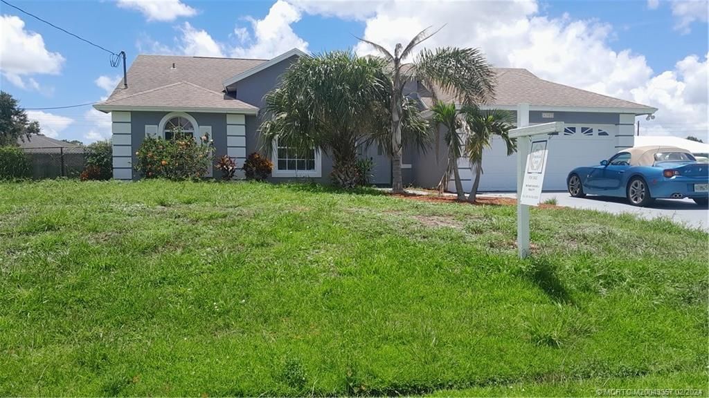Photo of 4502 SW Attlee Street, Port Saint Lucie, FL 34953 (MLS # M20043357)