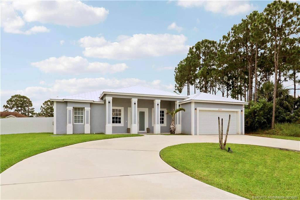 Photo of 6216 NW West Deville Circle, Port Saint Lucie, FL 34986 (MLS # M20056266)