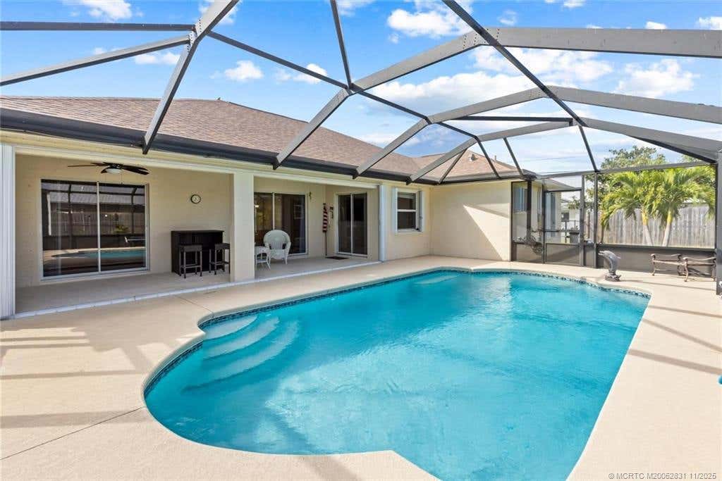 Photo of 2661 SW Fairgreen Road, Port Saint Lucie, FL 34987 (MLS # M20052831)