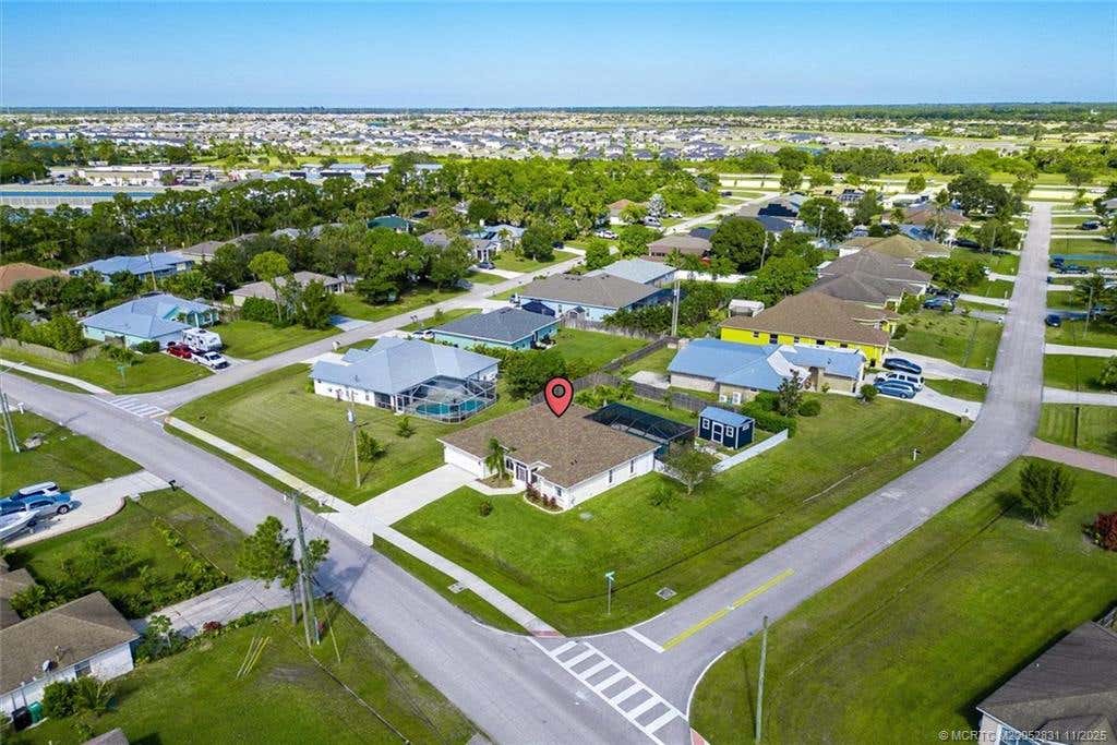 Photo of 2661 SW Fairgreen Road, Port Saint Lucie, FL 34987 (MLS # M20052831)