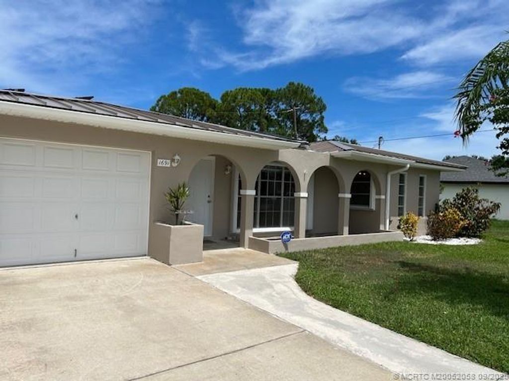 Photo of 1691 SE Grapeland Avenue, Port Saint Lucie, FL 34952 (MLS # M20052058)