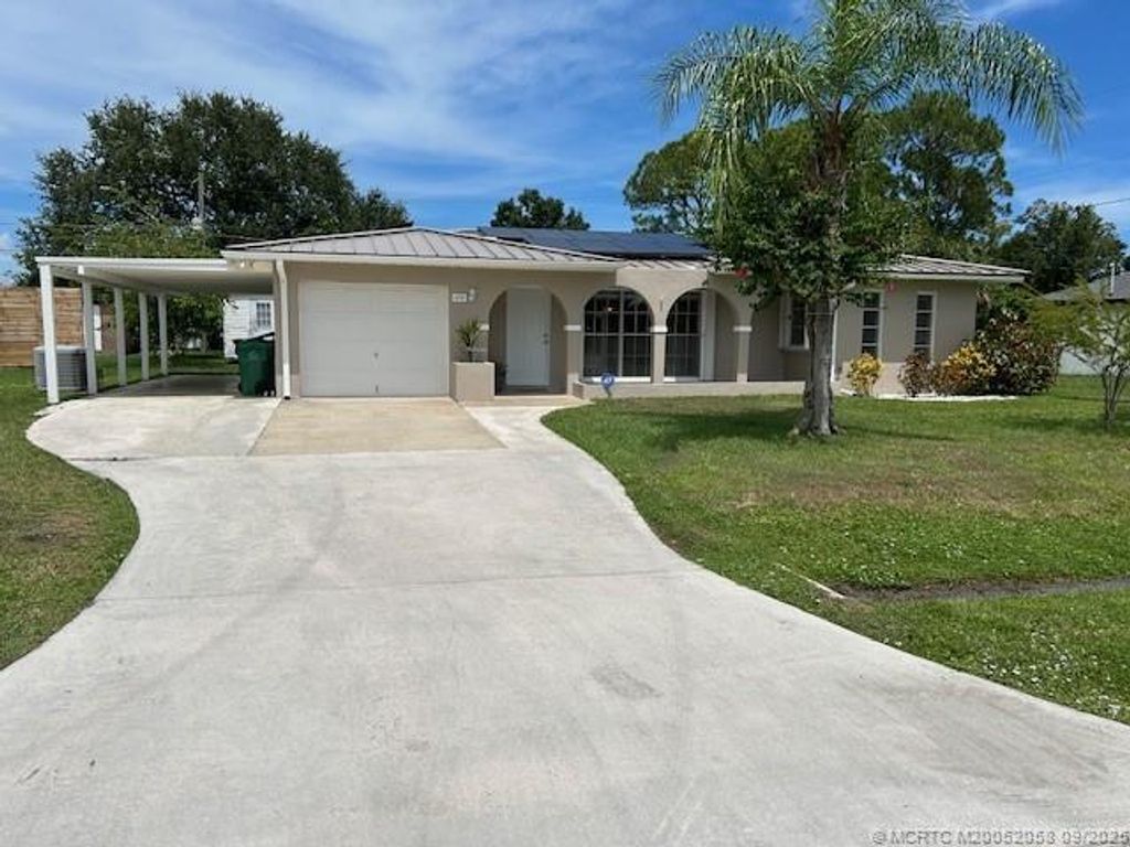 Photo of 1691 SE Grapeland Avenue, Port Saint Lucie, FL 34952 (MLS # M20052058)