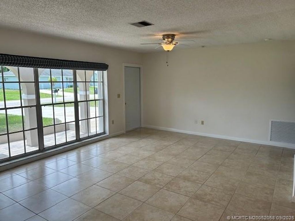Photo of 1691 SE Grapeland Avenue, Port Saint Lucie, FL 34952 (MLS # M20052058)