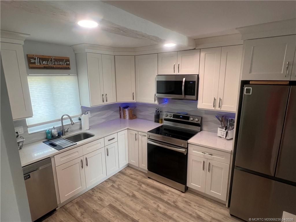 Photo of 1561 NE 12th Terrace NE, Jensen Beach, FL 34957 (MLS # M20055235)