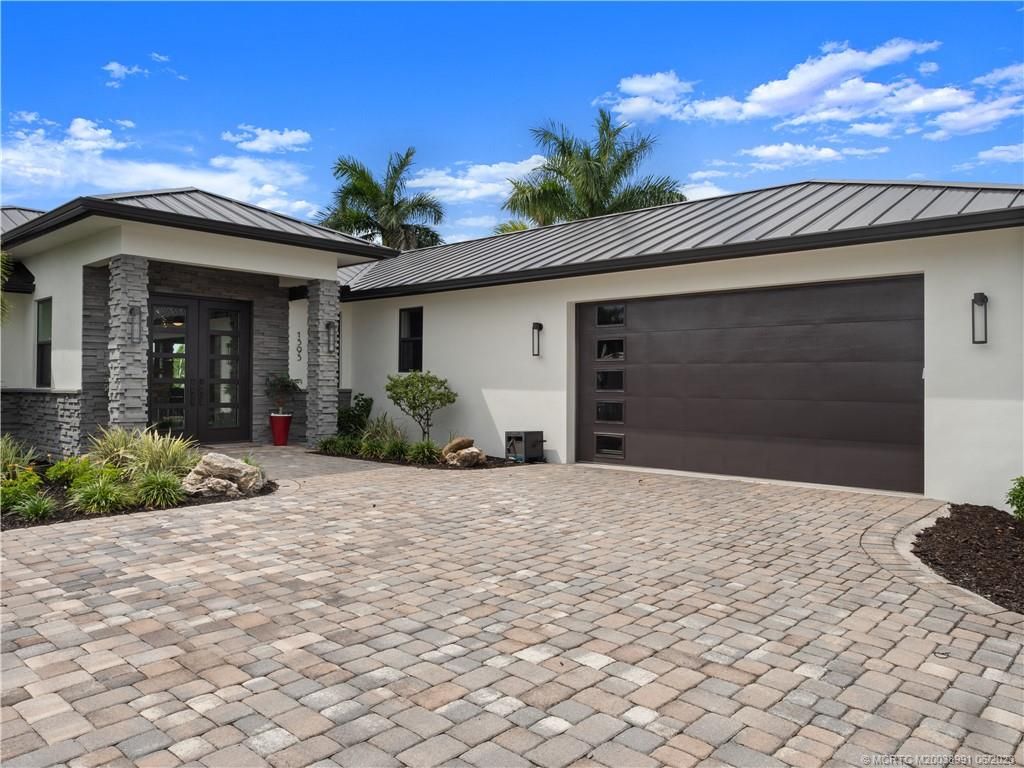 Photo of 1595 SW Egret Way, Palm City, FL 34990 (MLS # M20038991)