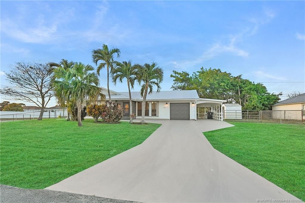 Photo of 981 SW Bay State Road, Port Saint Lucie, FL 34953 (MLS # M20054163)