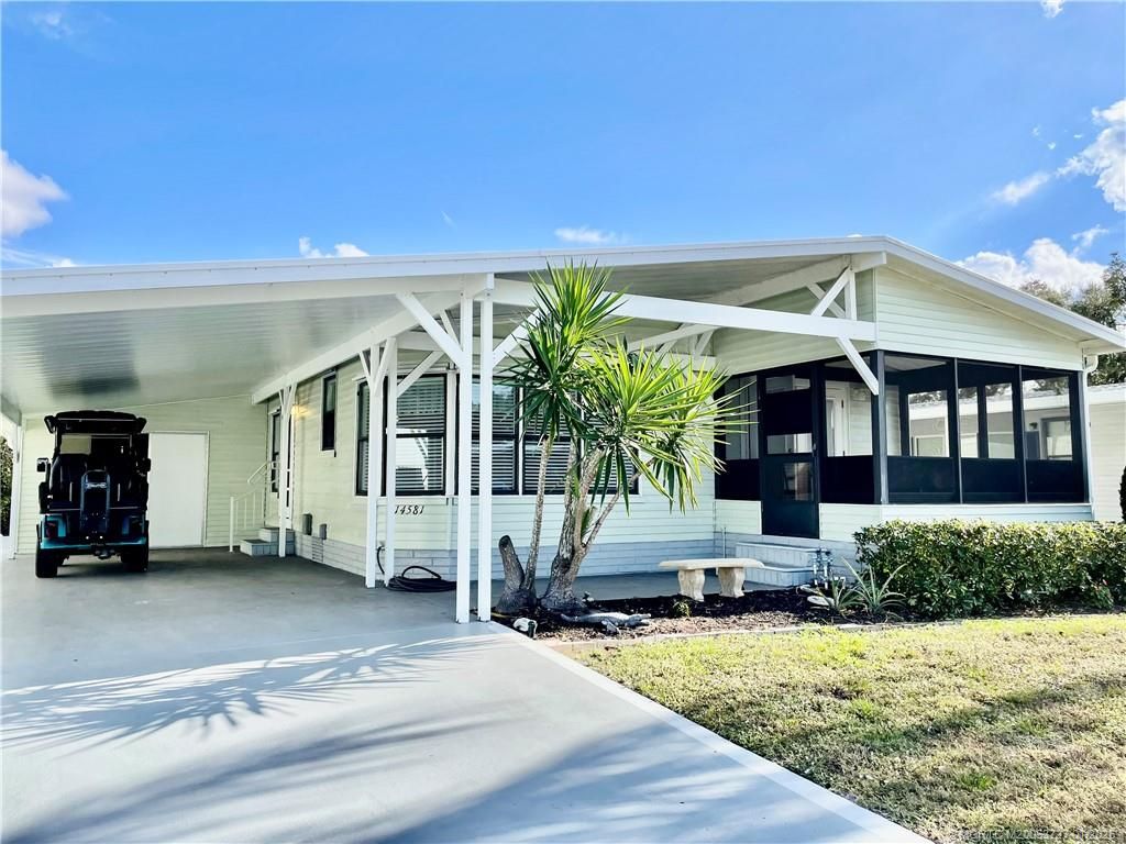 Photo of 14581 Divot Drive SW, Indiantown, FL 34956 (MLS # M20053727)