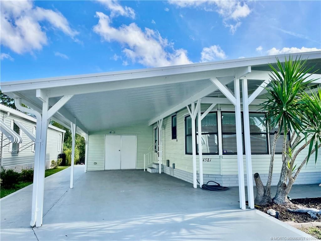 Photo of 14581 Divot Drive SW, Indiantown, FL 34956 (MLS # M20053727)