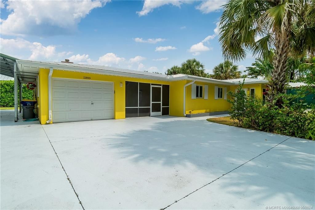 Photo of 11899 SE Indian River Drive N, Hobe Sound, FL 33455 (MLS # M20045068)