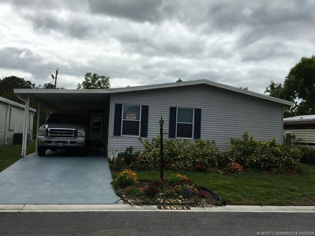 Photo of 14591 SW Divot Drive Dr #A-20, Indiantown, FL 34956 (MLS # M20055276)