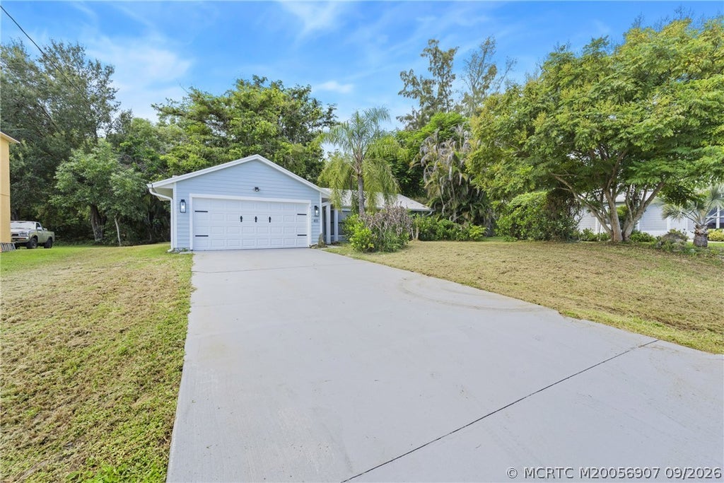 Photo of 411 SW Namoit Place, Port Saint Lucie, FL 34953 (MLS # M20056907)