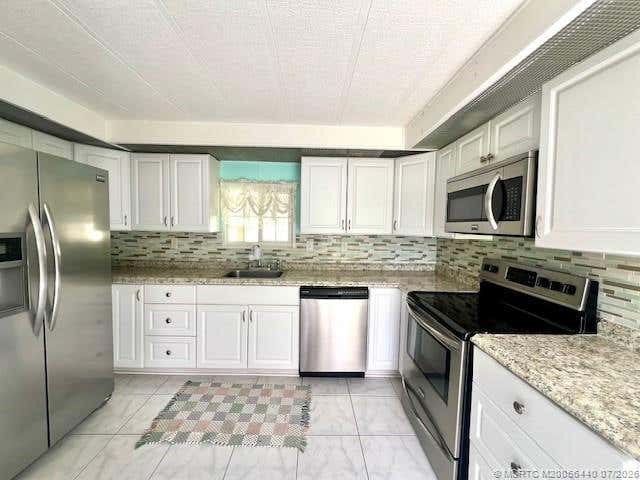 Photo of 4169 70th Lane N #1047, West Palm Beach, FL 33404 (MLS # M20056440)