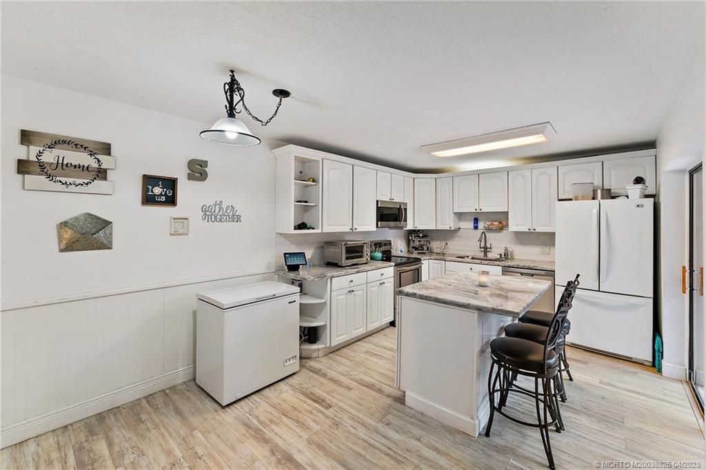 Photo of 6003 SE Windsong Lane, Stuart, FL 34997 (MLS # M20038825)