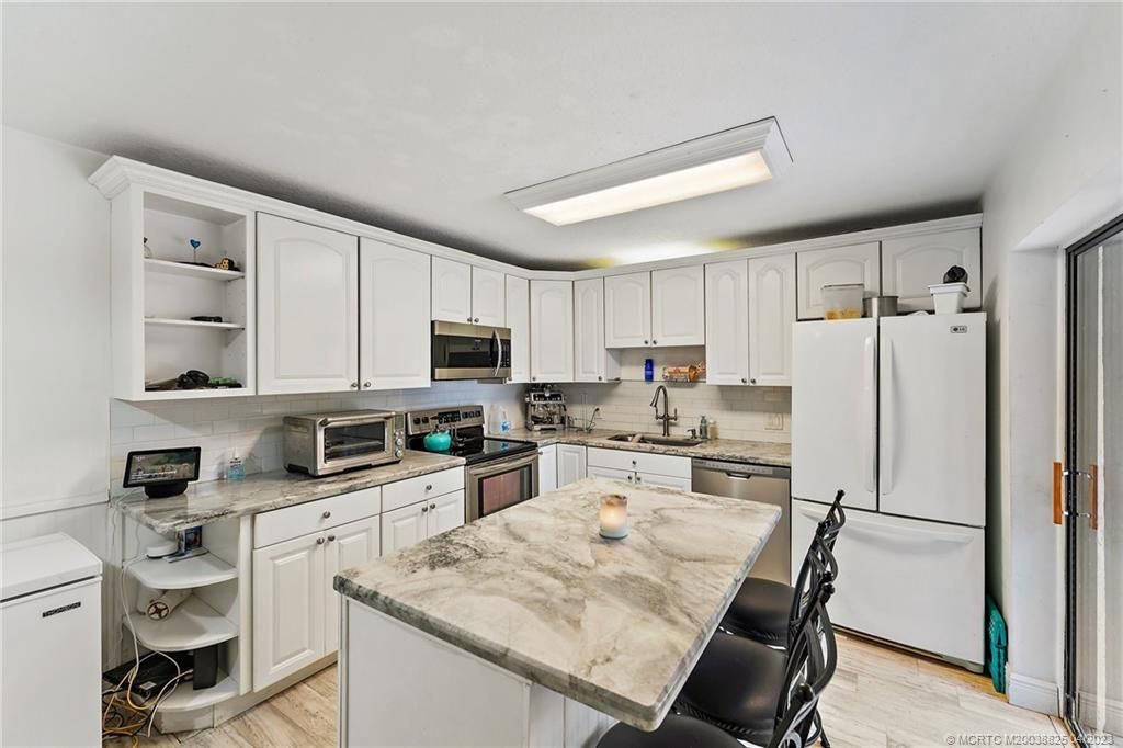 Photo of 6003 SE Windsong Lane, Stuart, FL 34997 (MLS # M20038825)