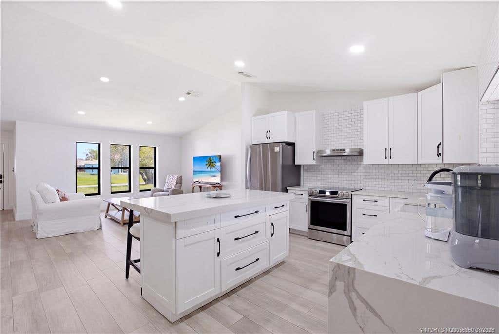Photo of 822 SE Cavern Avenue, Port Saint Lucie, FL 34983 (MLS # M20056350)