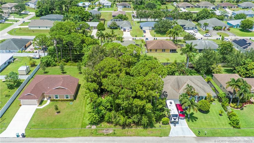 Photo of 3282 SW Crumpacker Street, Port Saint Lucie, FL 34953 (MLS # M20040371)