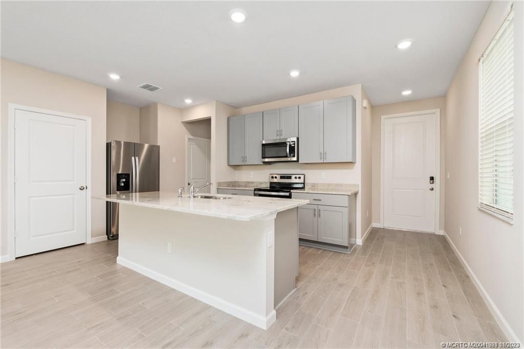 Photo of 211 Osprey Preserve Boulevard, Jensen Beach, FL 34957 (MLS # M20041921)