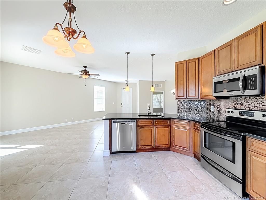 Photo of 211 SW Deleon Springs Drive, Port Saint Lucie, FL 34986 (MLS # M20053772)
