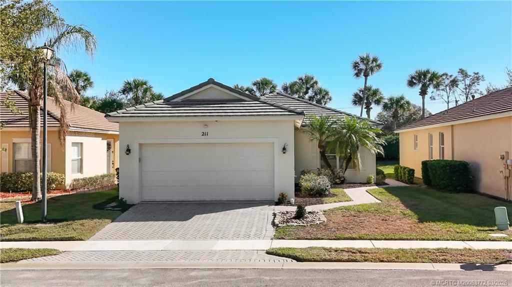 Photo of 211 SW Deleon Springs Drive, Port Saint Lucie, FL 34986 (MLS # M20053772)