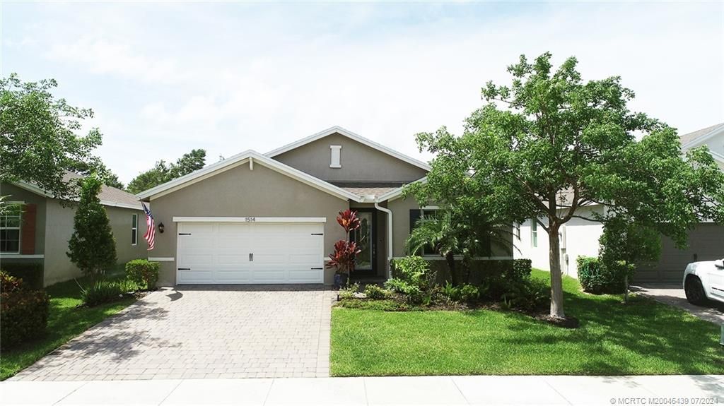 Photo of 1514 NE White Pine Terrace, Jensen Beach, FL 34957 (MLS # M20045439)