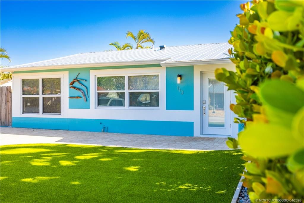 Photo of 113 N Las Olas Drive, Jensen Beach, FL 34957 (MLS # M20050063)