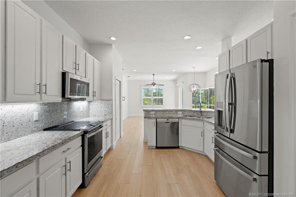 Photo of 371 NW Emilia Way, Jensen Beach, FL 34957 (MLS # M20056047)