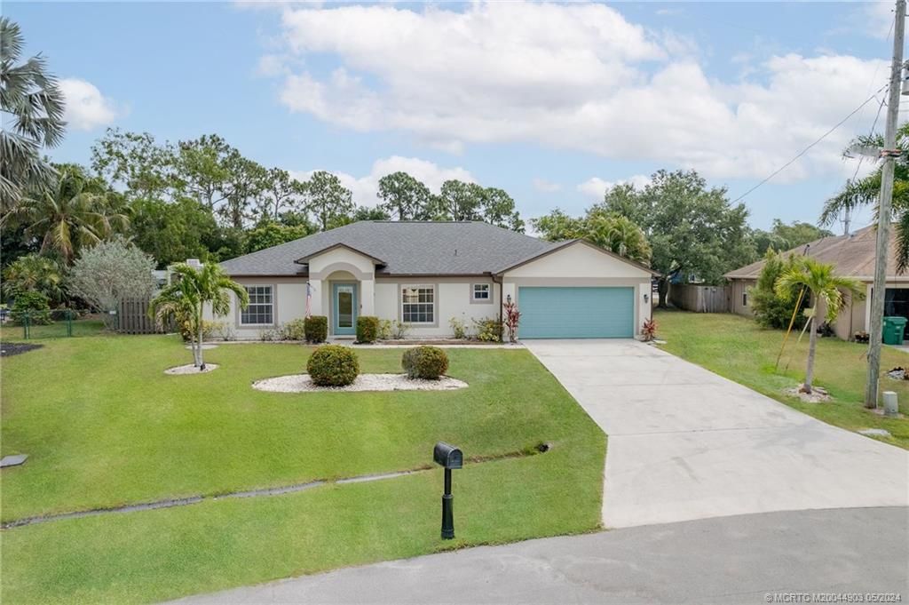Photo of 6443 NW Regal Circle, Port Saint Lucie, FL 34983 (MLS # M20044903)