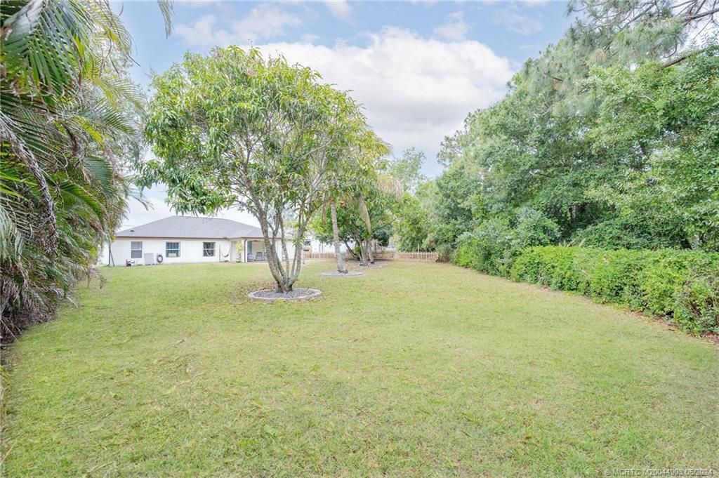 Photo of 6443 NW Regal Circle, Port Saint Lucie, FL 34983 (MLS # M20044903)