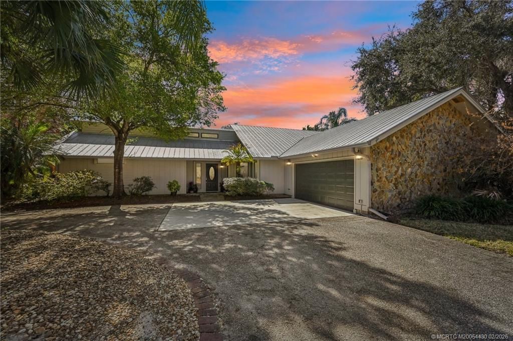 Photo of 1820 SW Crane Creek Avenue, Palm City, FL 34990 (MLS # M20054430)