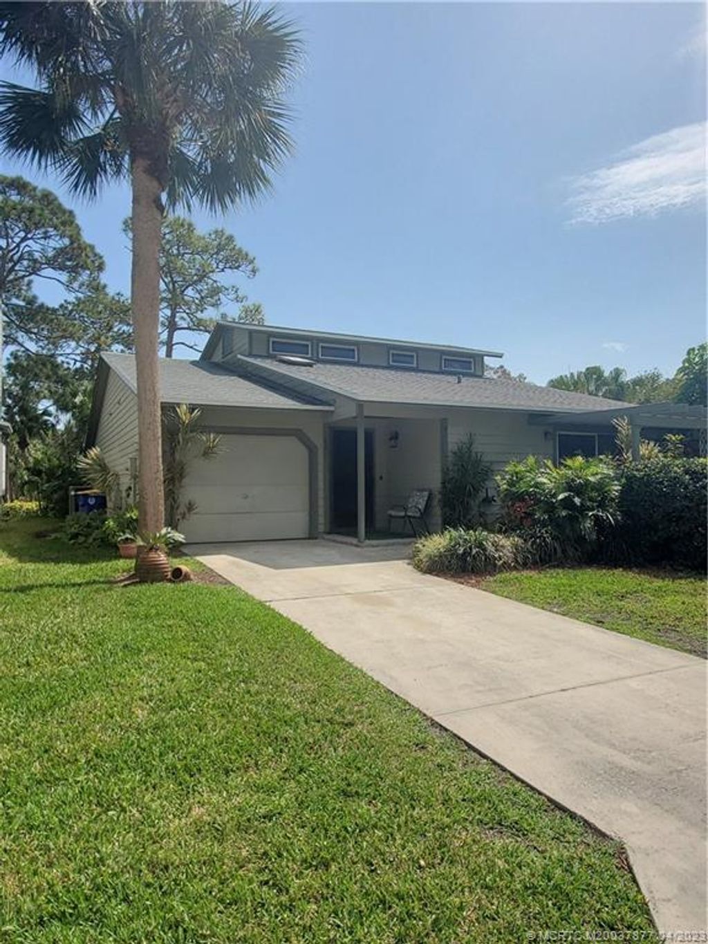 Photo of 671 NE Dahoon Terrace, Jensen Beach, FL 34957 (MLS # M20037877)