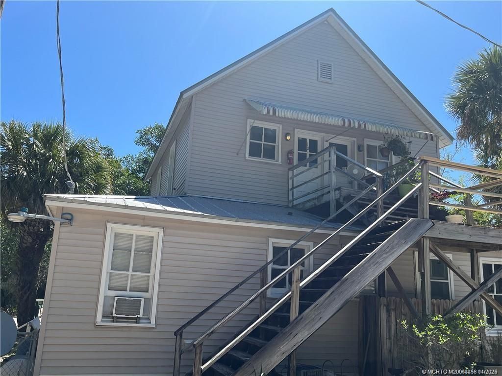 Photo of 2172 NE Poinciana Terrace, Jensen Beach, FL 34957 (MLS # M20053256)