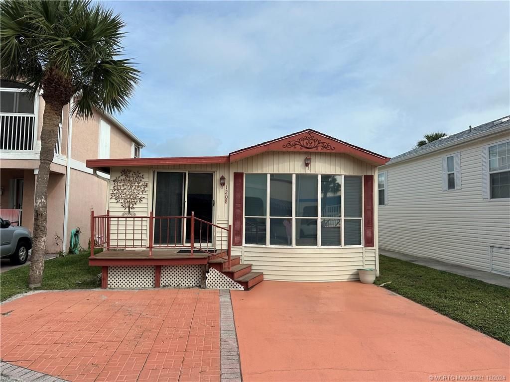 Photo of 1208 Nettles Boulevard, Jensen Beach, FL 34957 (MLS # M20043021)