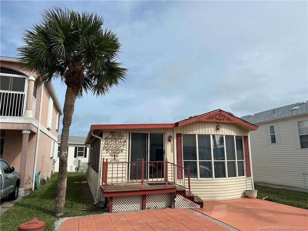 Photo of 1208 Nettles Boulevard, Jensen Beach, FL 34957 (MLS # M20043021)