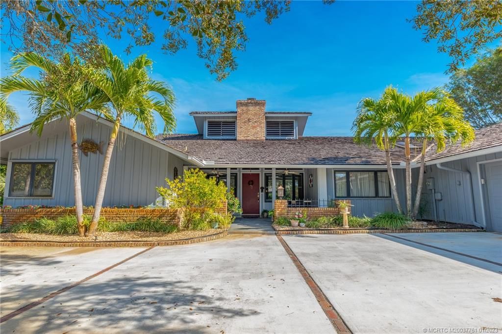 Photo of 3641 NE Sugarhill Avenue, Jensen Beach, FL 34957 (MLS # M20037761)