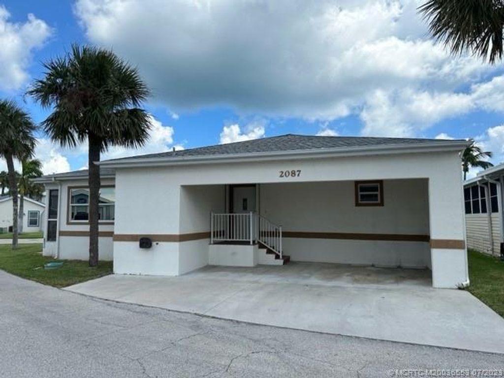 Photo of 2087 Nettles Boulevard, Jensen Beach, FL 34957 (MLS # M20036553)