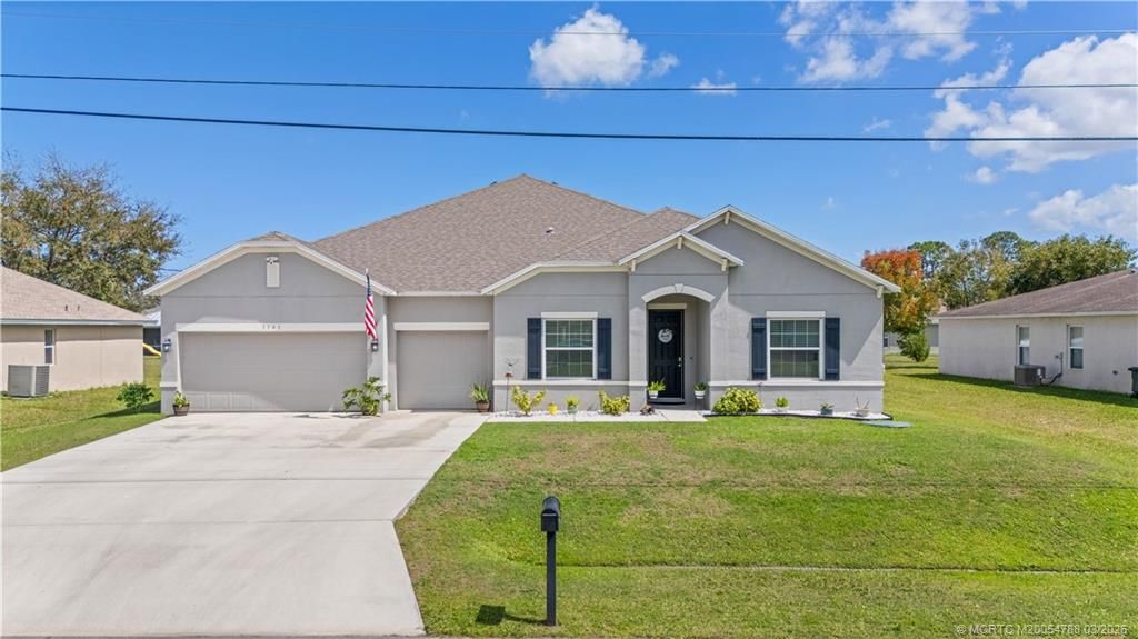 Photo of 3141 SW Letchworth Street, Port Saint Lucie, FL 34953 (MLS # M20054788)