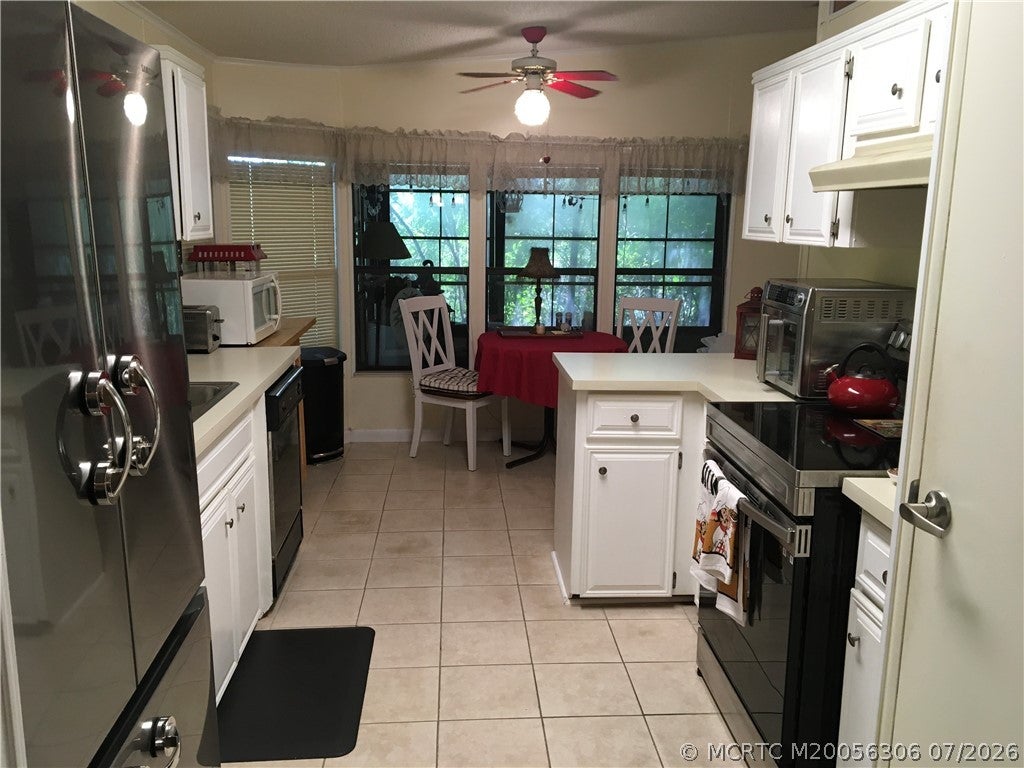 Photo of 14421 SW Divot Drive DR #A-37, Indiantown, FL 34956 (MLS # M20056306)