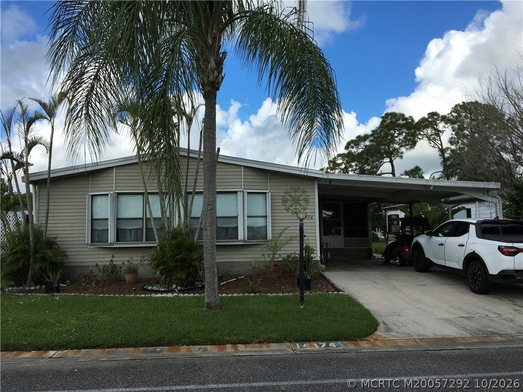 Photo of 14474 SW Rake Drive #K-06, Indiantown, FL 34956 (MLS # M20057292)