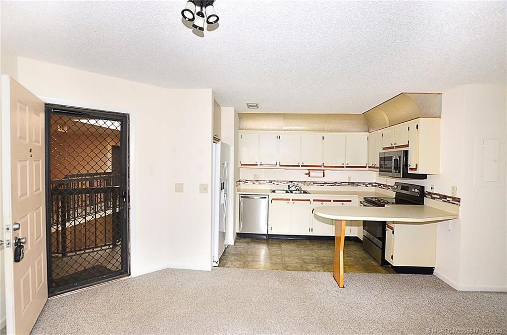 Photo of 1999 NE Collins Circle #3-80, Jensen Beach, FL 34957 (MLS # M20055471)