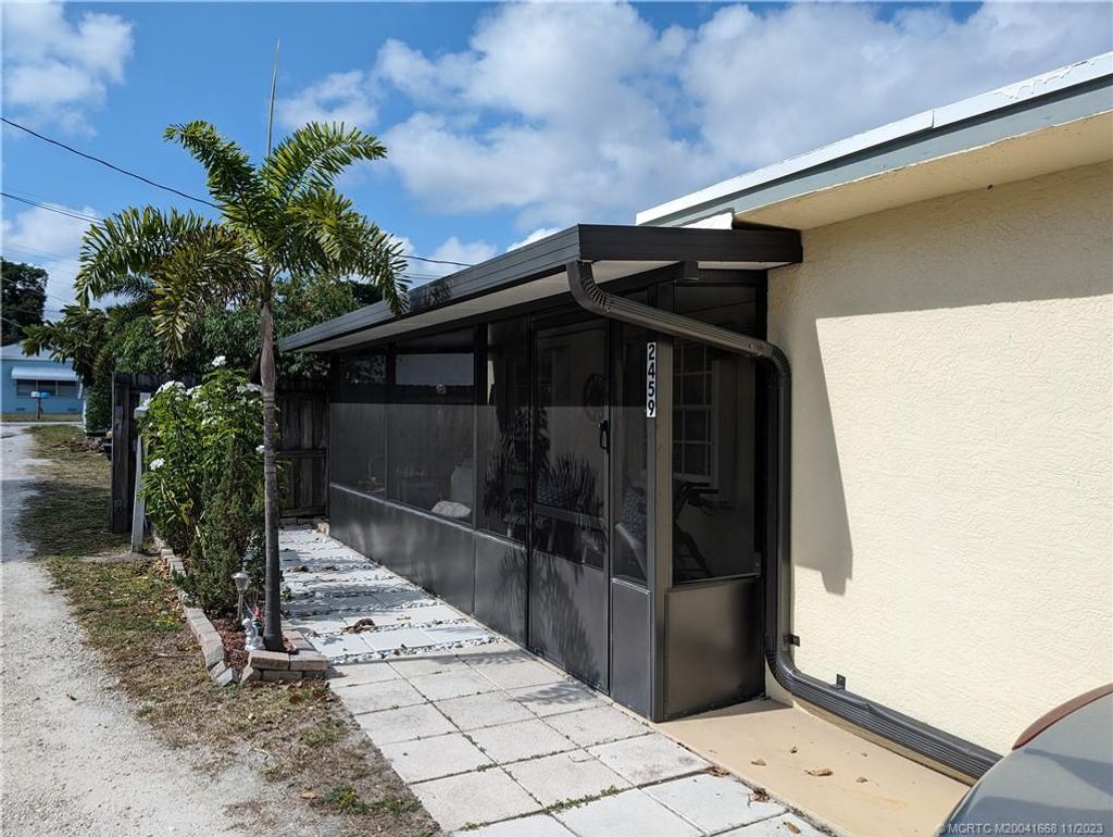 Photo of 2459 NE Hickory Avenue, Jensen Beach, FL 34957 (MLS # M20041668)