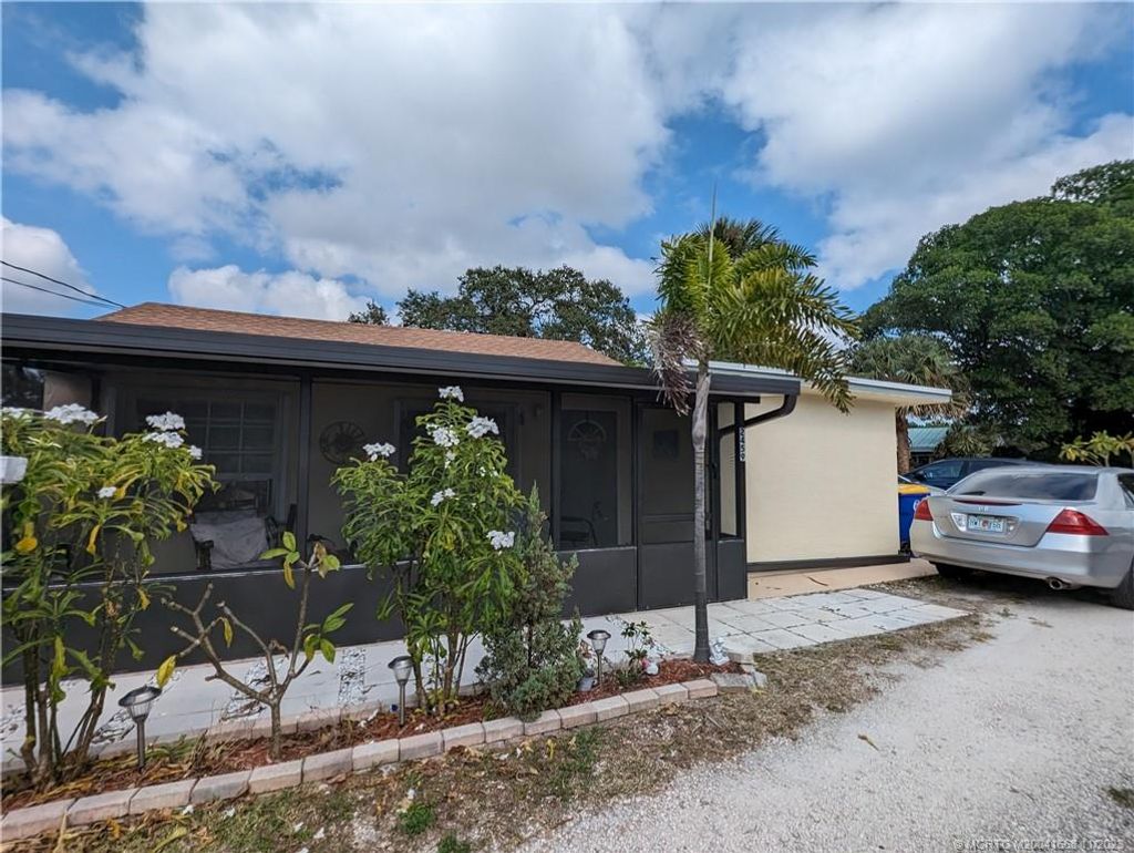 Photo of 2459 NE Hickory Avenue, Jensen Beach, FL 34957 (MLS # M20041668)