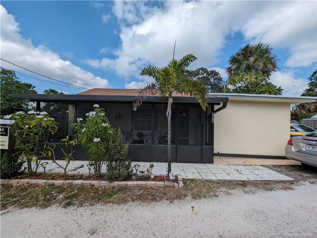 Photo of 2459 NE Hickory Avenue, Jensen Beach, FL 34957 (MLS # M20041668)