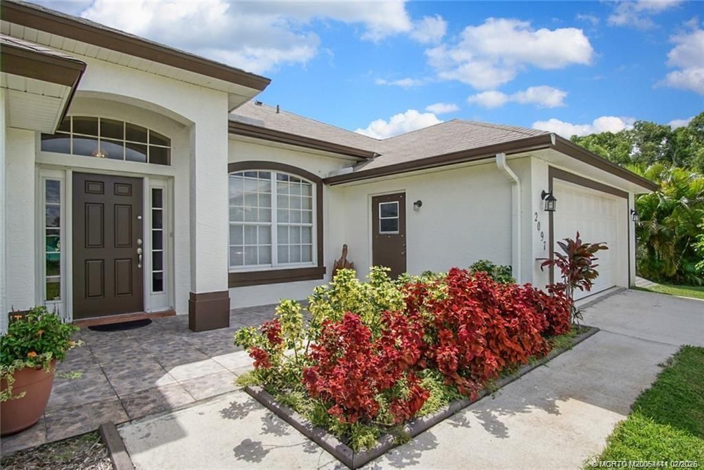 Photo of 2097 SE Dranson Circle, Port Saint Lucie, FL 34952 (MLS # M20054411)