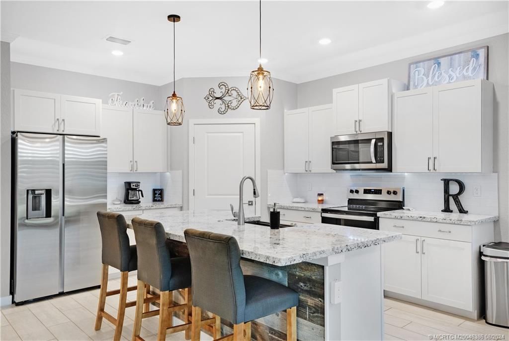 Photo of 4620 NW Exchange Avenue, Jensen Beach, FL 34957 (MLS # M20046386)