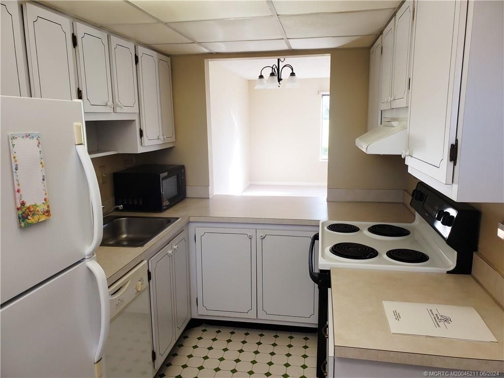 Photo of 5353 SE Miles Grant Road #F 102, Stuart, FL 34997 (MLS # M20045211)