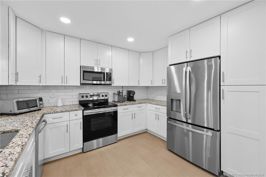 Photo of 3289 NE Holly Creek Drive, Jensen Beach, FL 34957 (MLS # M20055086)